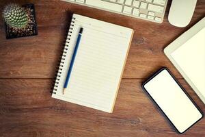 Working place. desktop, notebook, phone and tablet for table setting. photo