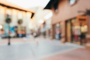 Vintage tone blurred defocused day of crowd people in walking street festival and shopping mall. photo