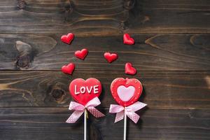 Valentines day heart shaped cookies on wooden table background with copy space. photo