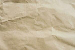 Brown paper crumpled texture and background with space. photo