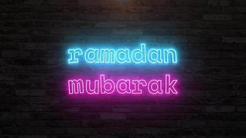 Ramadan mubarak with neon text effect in wall background. Seamless looping video