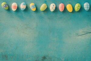 Colorful easter egg on blue pastel color wood background with space. photo