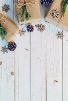 Homemade wrapped christmas gift box presents on a wood table background. photo