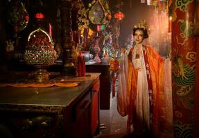 Portrait of a Chinese woman with a hand lantern In sacred shrines or temples, And in Chinese where hand lamp mean good luck and happiness photo