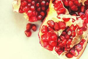 pomegranate seeds close-up. pomegranate on a light background photo