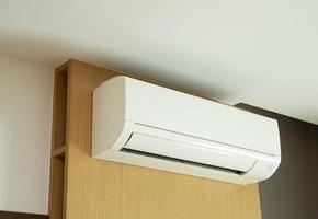 Split air conditioner installed on  wooden wall. photo