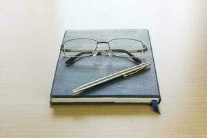 Glasses put on a book photo