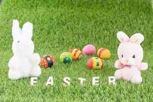 Bunny toys and Easter eggs with text photo