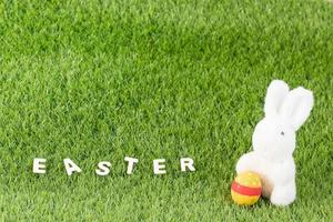 Bunny toy and Easter eggs with text photo