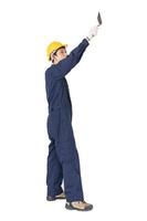 Workman with blue coveralls and hardhat in a uniform holding steel trowel photo