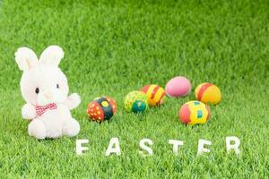 Bunny toy and Easter eggs with text photo