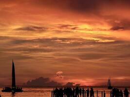 Summer Sunset after Storm showing colors of red, orange, and yellow photo