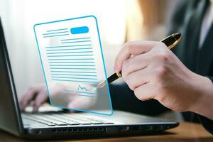 Electronic signature concept and technology and online document management DMS for paperless offices. Businessman uses pen to sign electronic documents on virtual screen digital document. photo