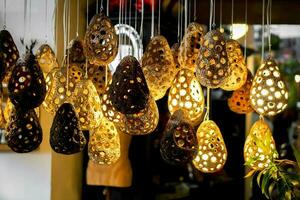 Lamp decorated like bird's nest showing by turn on light in the small pub. photo