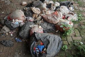 piles of trash on the edge of an empty shop photo