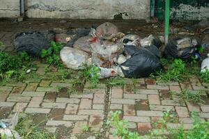 piles of trash on the edge of an empty shop photo