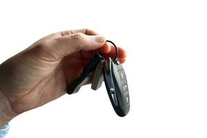 Hand holds a car keys with central locking