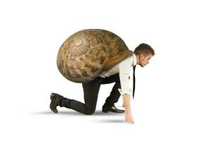 Businessman like a slow snail is ready to start photo