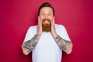 Happy isolated man with beard and white t-shirt photo