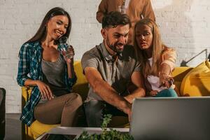 Business people that work together in office with a laptop photo