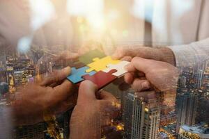Teamwork of partners. Concept of integration and startup with puzzle pieces photo