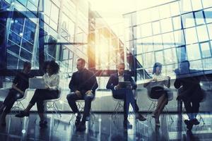 Business people connected on internet network with laptop and tablet. concept of startup company. double exposure photo