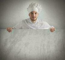 Chef showing his menu on a billboard photo