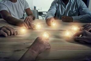 Teamwork and brainstorming concept with businessmen that share an idea with a lamp. Concept of startup photo