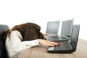 Stressed businesswoman due to overwork photo