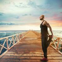 Exercises of gymnastics on a pier photo