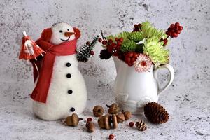 Still life with snowman and flowers photo