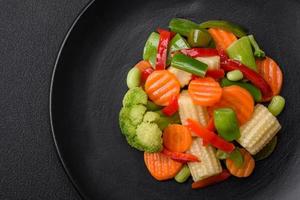 Delicious juicy broccoli vegetables, carrots, asparagus beans and bell peppers photo