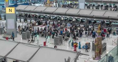 June 2,2022 Bangkok,Thailand timelapse view inside departure terminal with many passenger at check-in counter. suvarnabhumi airport thailand reopening country video