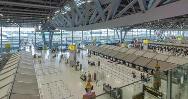 June 2,2022 Bangkok,Thailand timelapse view inside departure terminal with many passenger at check-in counter. suvarnabhumi airport thailand reopening country video