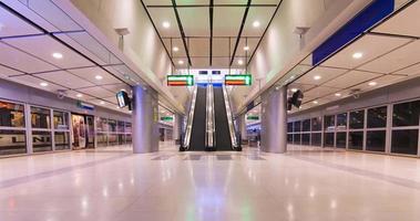 June 2,2022 Bangkok,Thailand timelapse view inside airport rail link train terminal with passenger arriving at suvarnabhumi airport and using escalator. reopening country video