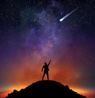 Businessman indicate a falling star photo