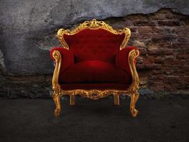 Red and gold luxury armchair into an old room photo