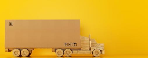 Big cardboard box package on a wooden toy truck ready to be delivered on yellow background photo