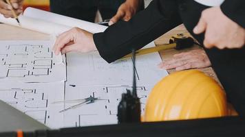 architect man working with laptop and blueprints,engineer inspection in workplace for architectural plan,sketching a construction project ,selective focus,Business concept vintage color video