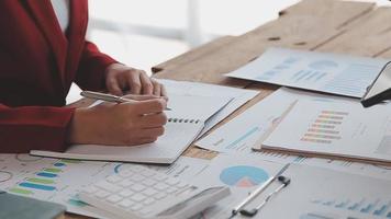 Financial analysts analyze business financial reports on a digital tablet planning investment project during a discussion at a meeting of corporate showing the results of their successful teamwork. video