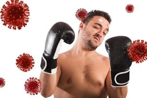 Man fights like a boxer. Concept of viruses and bacteria attack photo