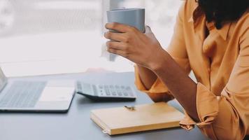 Financial analysts analyze business financial reports on a digital tablet planning investment project during a discussion at a meeting of corporate showing the results of their successful teamwork. video