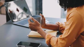 Financial analysts analyze business financial reports on a digital tablet planning investment project during a discussion at a meeting of corporate showing the results of their successful teamwork. video
