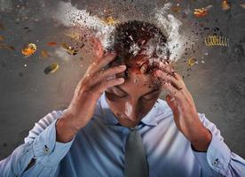 Head explosion of a stressed and tired businessman due to overwork. photo