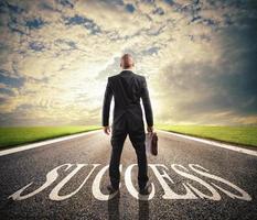 Man walks on a success way. Concept of successful businessman and company startup photo