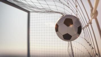 Close up of a soccer ball scoring a goal photo