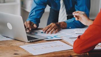 Financial analysts analyze business financial reports on a digital tablet planning investment project during a discussion at a meeting of corporate showing the results of their successful teamwork. video