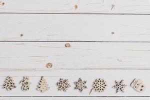 Wooden white and christmas background with snowflakes and christmas decoration. photo