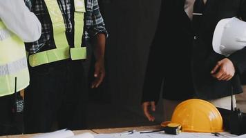 architect man working with laptop and blueprints,engineer inspection in workplace for architectural plan,sketching a construction project ,selective focus,Business concept vintage color video