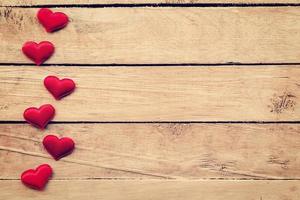 Red heart on wood background with space. vintage toned. photo